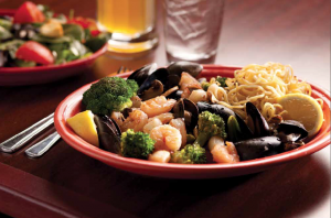 shrimp and mussels with vegetables on a plate