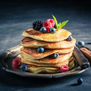 Homemade american pancakes with blueberries and raspberries