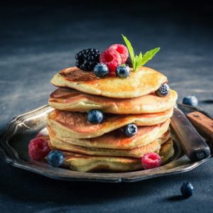 plate of pancakes with berries