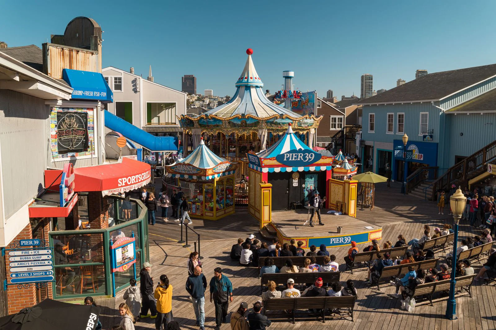 Pier 39 in San Francisco showing a carousel and several businesses
